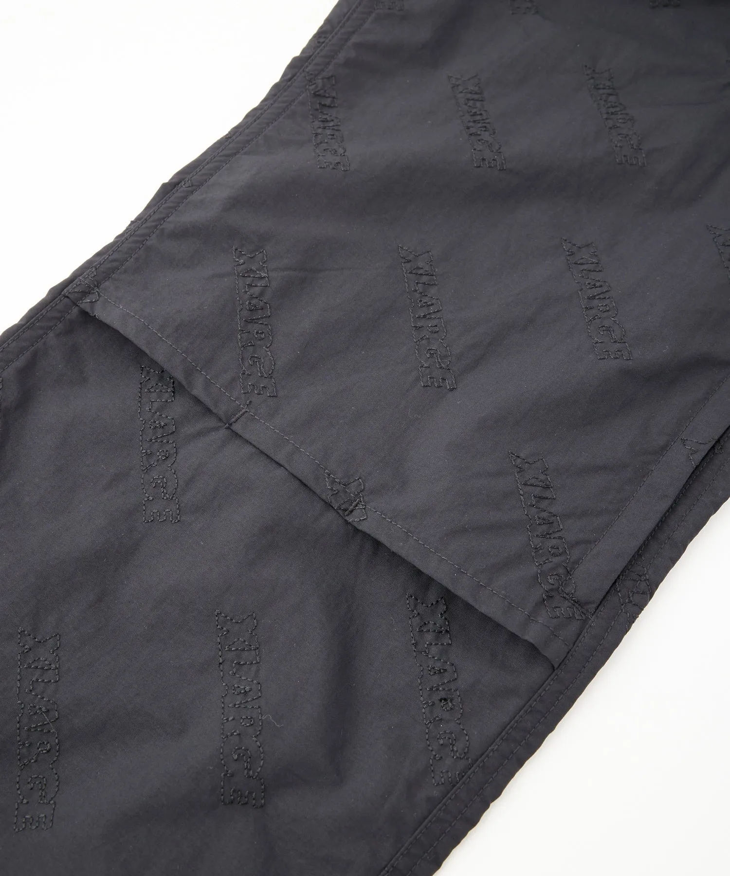 ALLOVER LOGO PATTERN EMBROIDERED NYLON PANTS